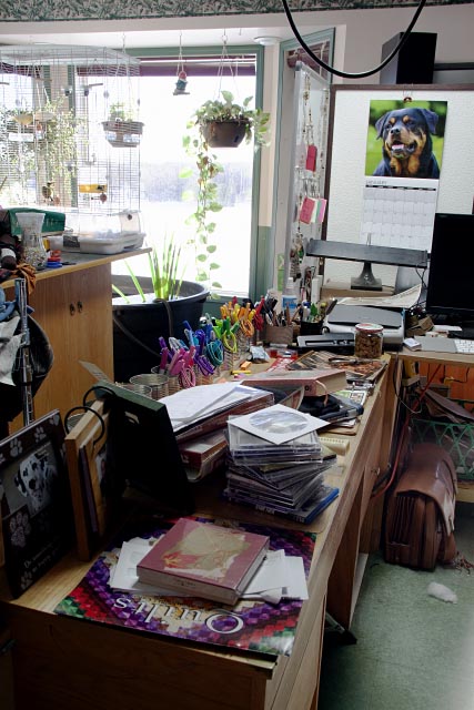 an overloaded, very messy creative's desk...messy